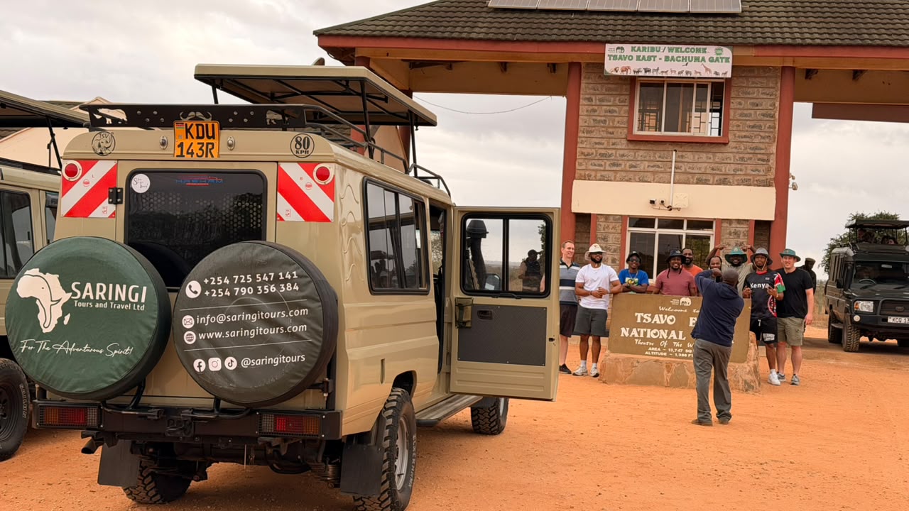 Saringi clients arriving at Tsavo East Bachuma Gate with branded safari vehicle